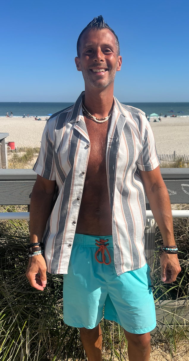 Man wearing striped men's button down shirt unbuttoned - Island Soul Clothing & Gifts Seaside Heights New Jersey