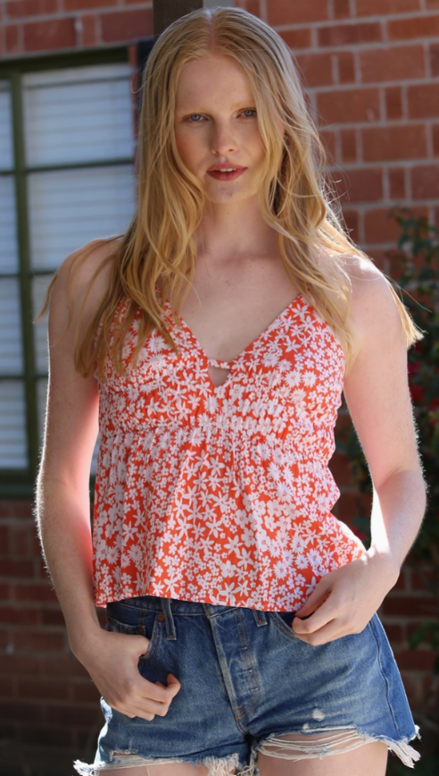 Woman in a Orange halter top with white flowers - Island Soul Clothing & Gifts Seaside Heights New Jersey