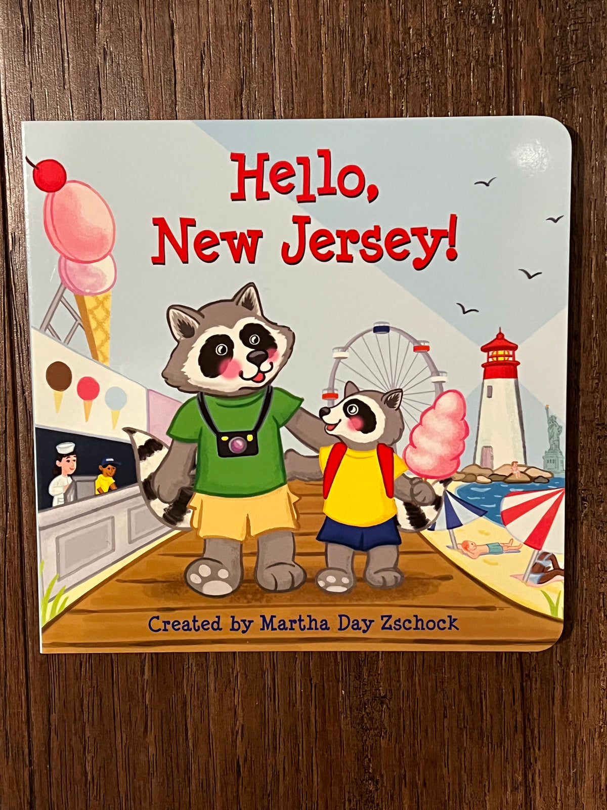 Children's book titled 'Hello, New Jersey!' with illustrations of raccoons on the boardwalk - Island Soul Clothing & Gifts Seaside Heights New Jersey