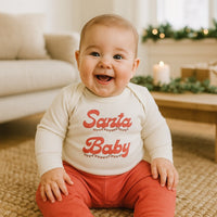 Long sleeve baby onesie with red  "Santa Baby" text in red with Christmas Lights Graphic on a white background - Island Soul Clothing & Gifts Seaside Heights New Jersey