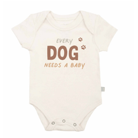Baby onesie with 'Every Dog Needs a Baby' text on a white background - Island Soul Clothing & Gifts Seaside Heights New Jersey