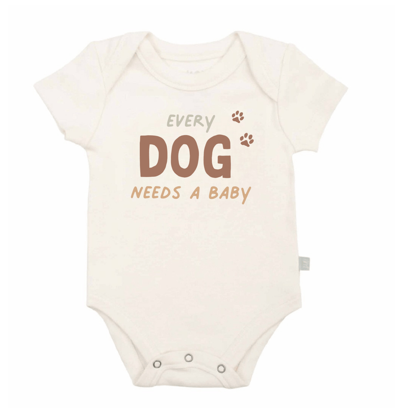 Baby onesie with 'Every Dog Needs a Baby' text on a white background - Island Soul Clothing & Gifts Seaside Heights New Jersey