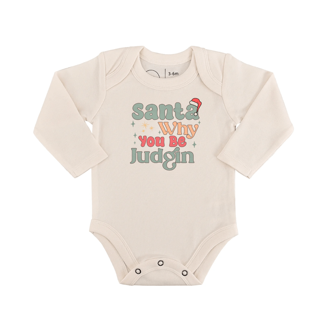 Baby onesie with "Santa Why You Be Judgin'" text on a off white background - Island Soul Clothing & Gifts Seaside Heights